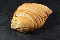 Isolate of white loaf of bread with sliced Ã¢â¬â¹Ã¢â¬â¹pieces on a black background Royalty Free Stock Photo